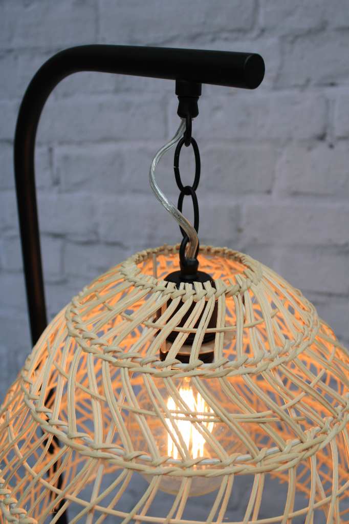 Black floor lamp with suspended rattan shade