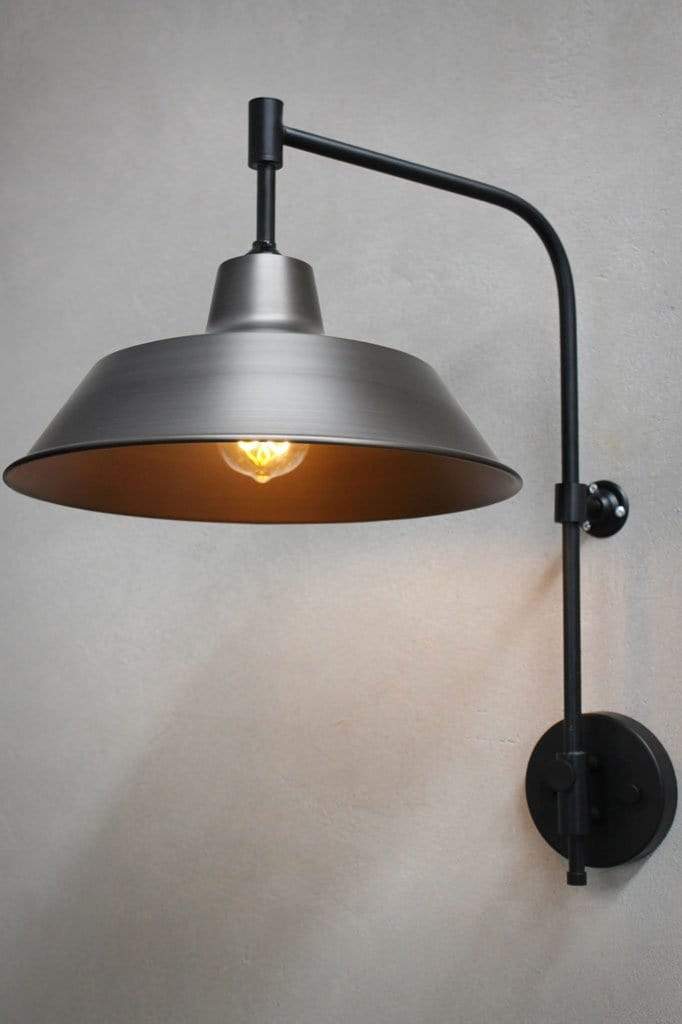 Raw steel wall light