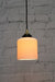 Ribbed ceramic pendant light with gold/brass cord