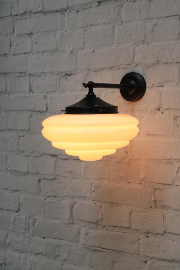 Wall light with black adjustable sconce