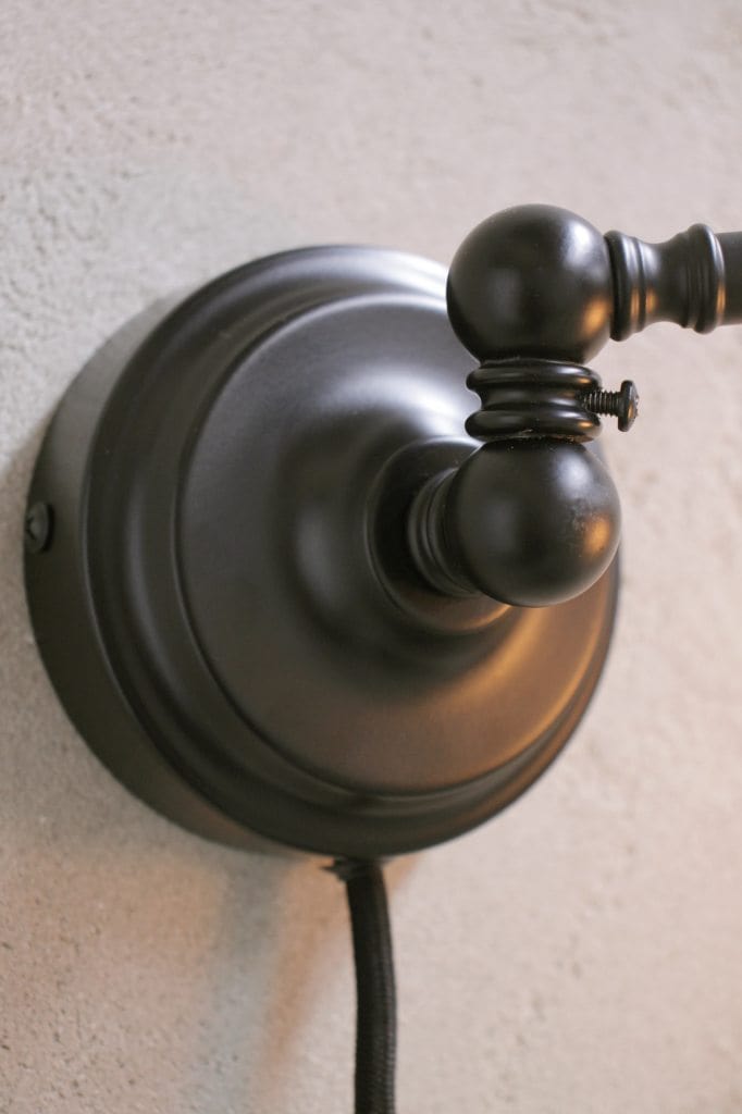 Wall sconce with rotary joint