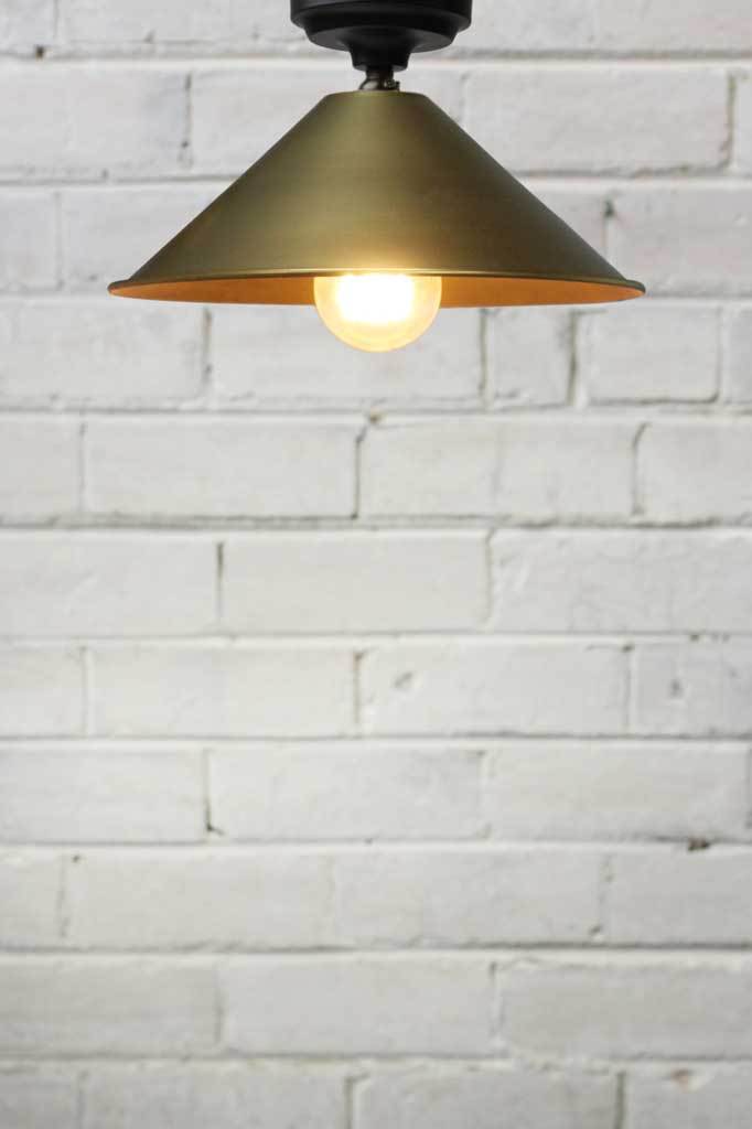 Small bright brass shade curved