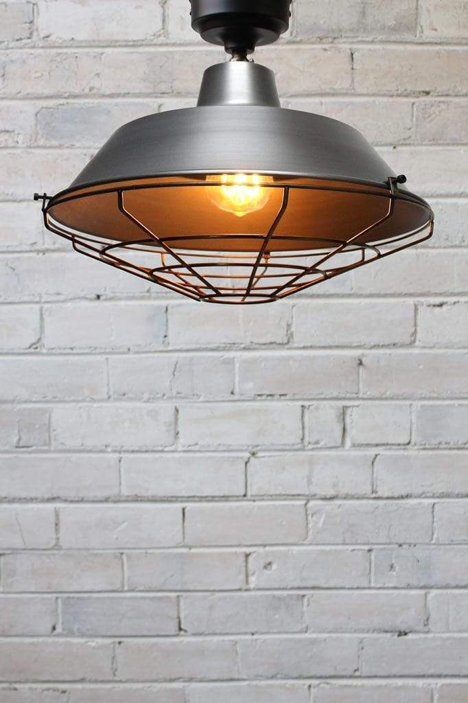 Cage cover for raw steel ceiling light