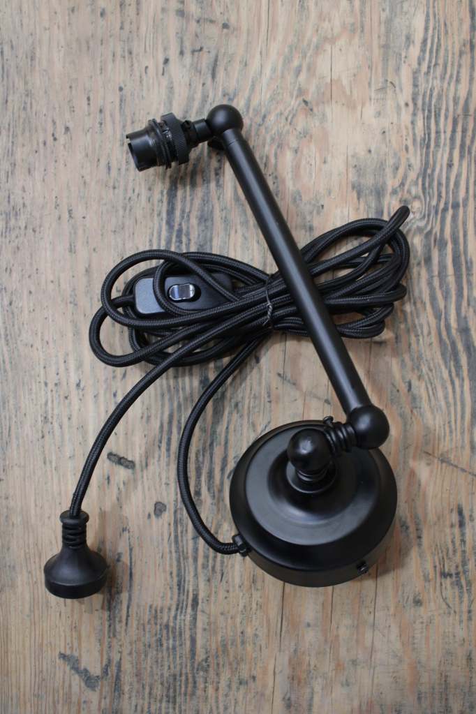 Adjustable black finish steel wall light with wall plug