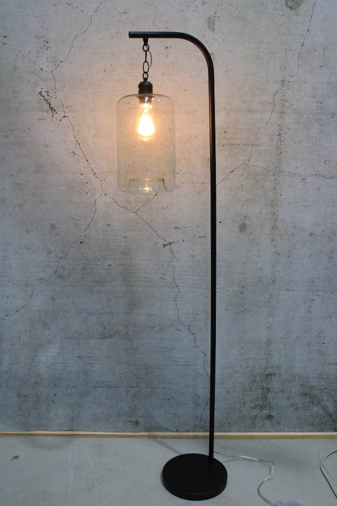 Black floor lamp with suspended cylinder shade