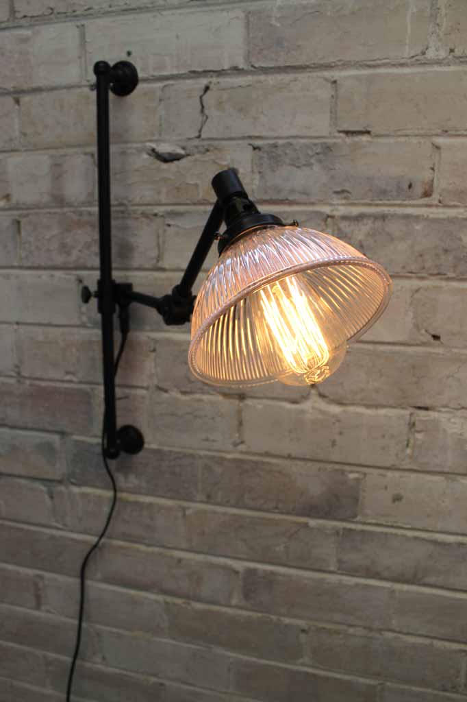 Swing arm wall light with glass shade