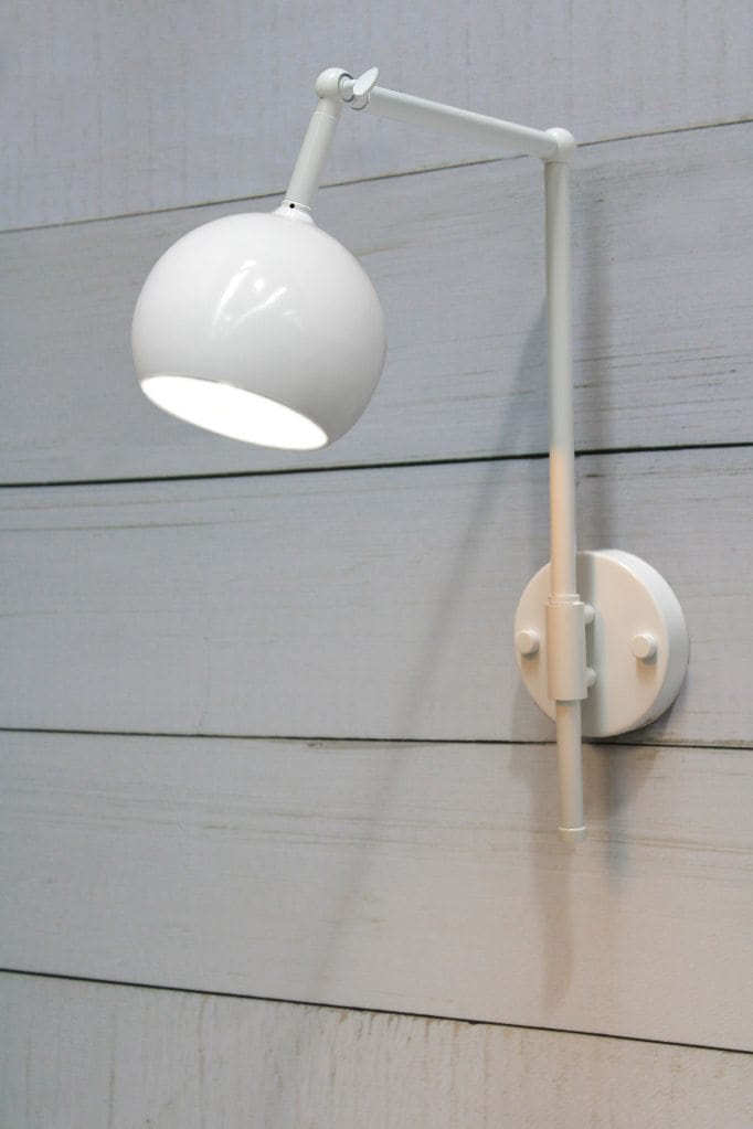 White swivel wall light with round white shade