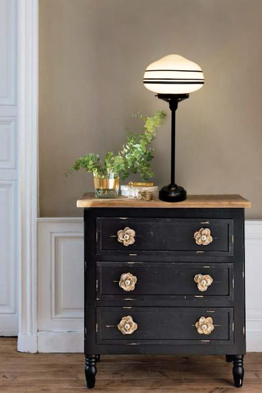 Black base with three stripe shade on drawer