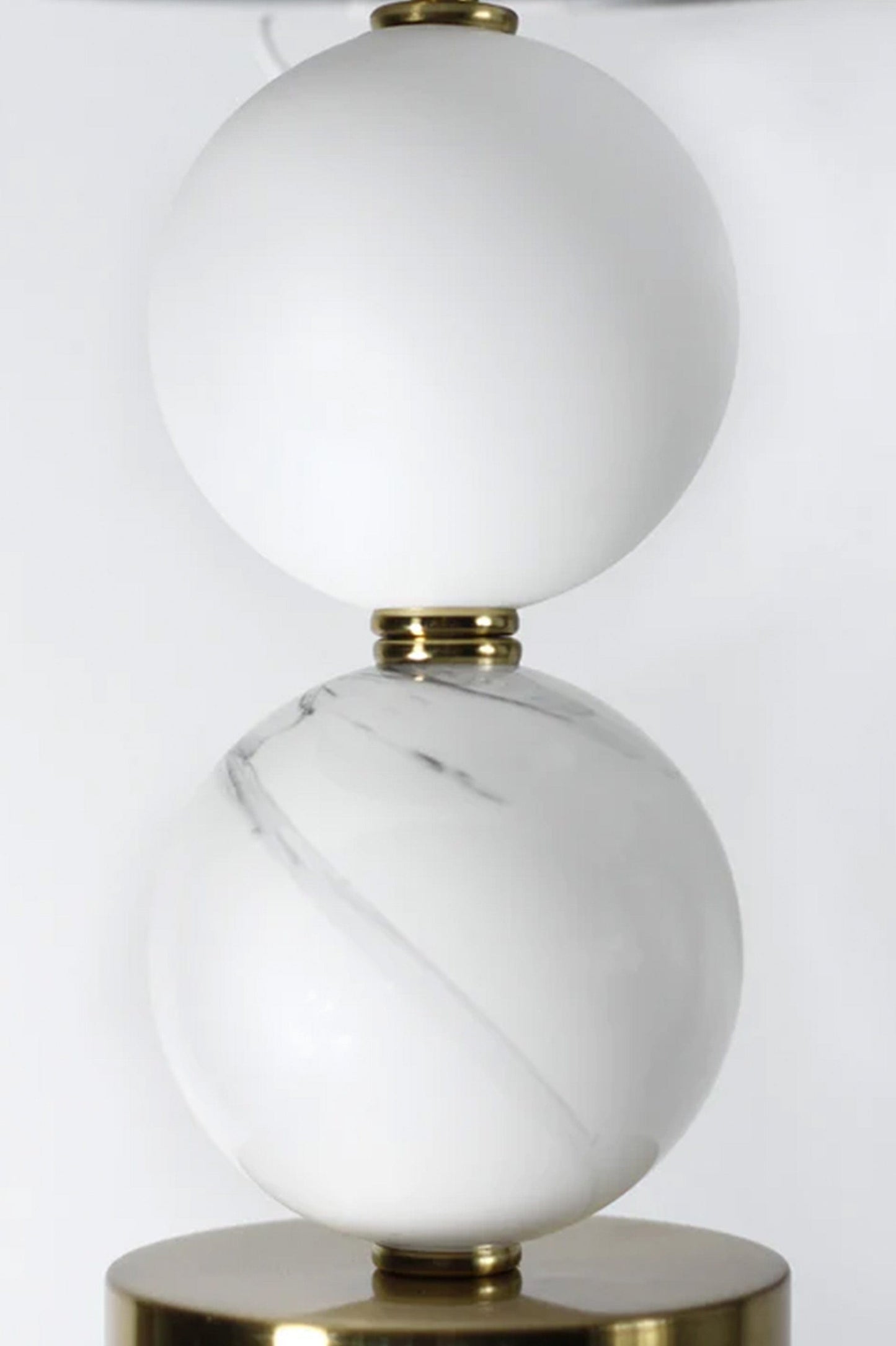 Close-up of white and marble orbs. 