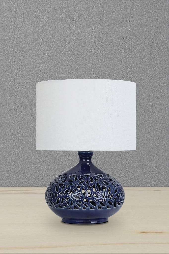 Ceramic table lamp with white linen shade and navy blue base. 