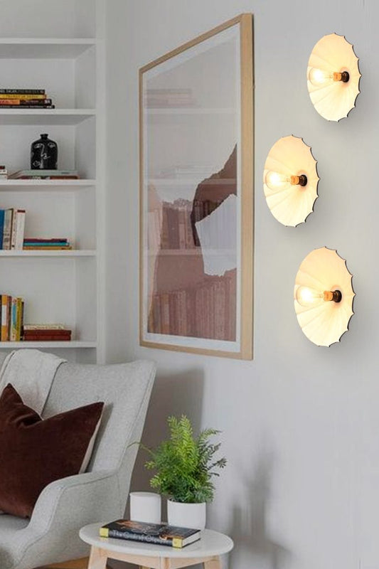 Three umbrella wall lights mounted in room