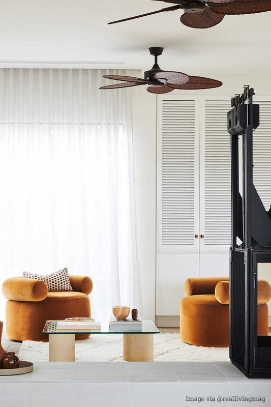 Dark wood ceiling fan in a living room.