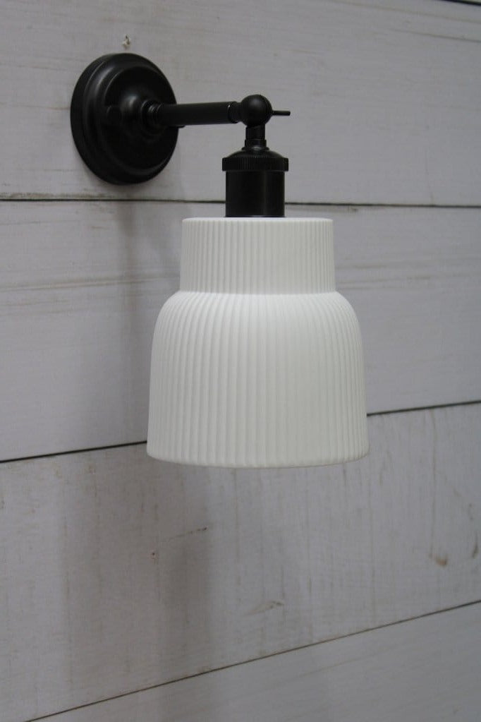 Black wall light with ceramic shade