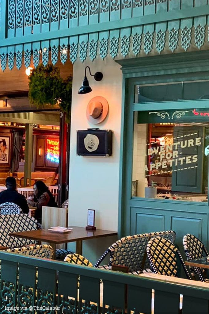 Classic black wall sign light in a restaurant. 