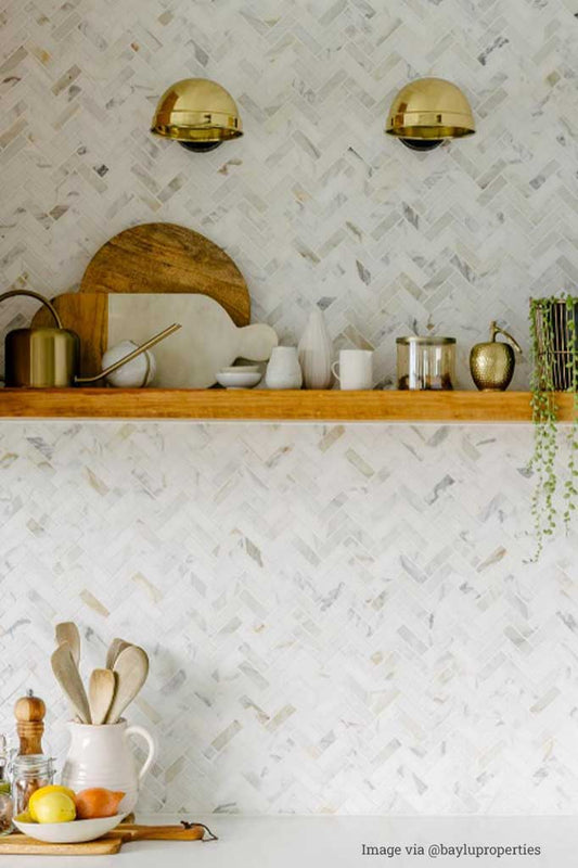 Antique bronze wall lamp in a kitchen.