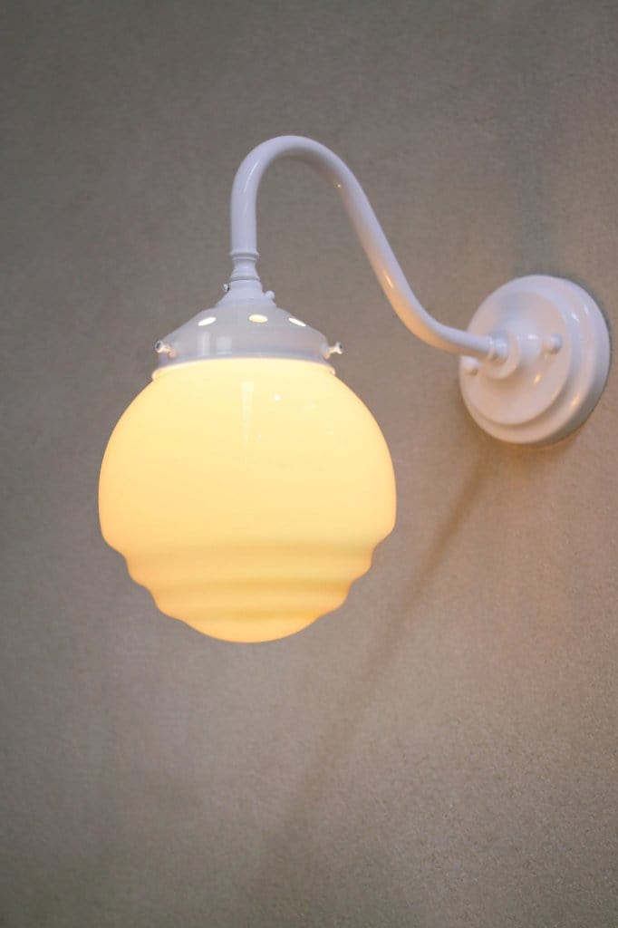 White wall light with rippled opal shade