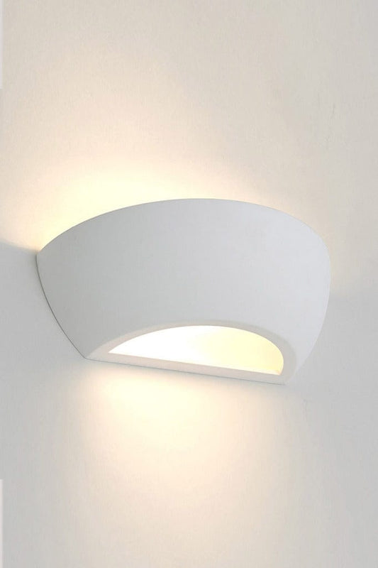 Lit up semicircle plaster wall light affixed on wall. 