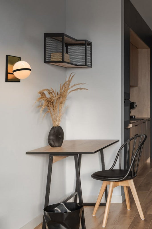 Glass ball wall light over home office