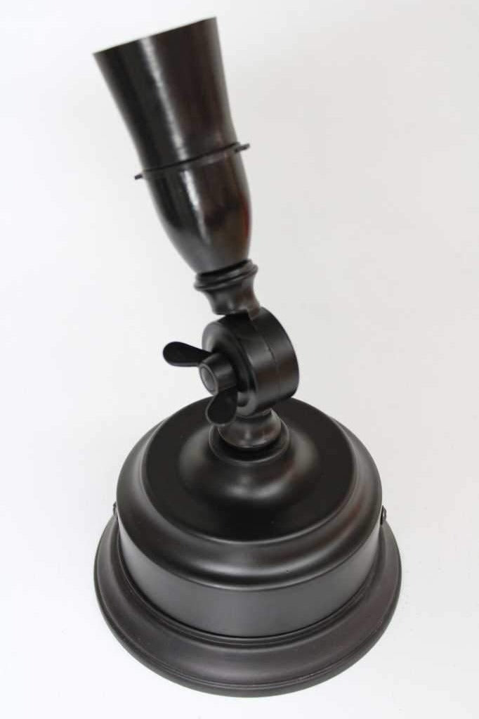 black wall lamp holder on a black wooden block