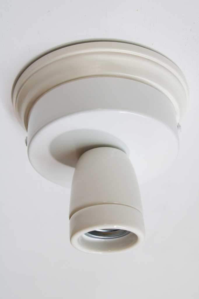 White ceiling rose with a white lamp holder