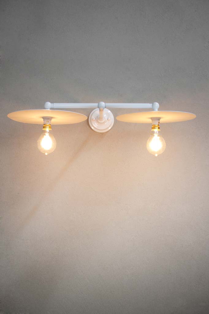 White double arm wall light with large white discs