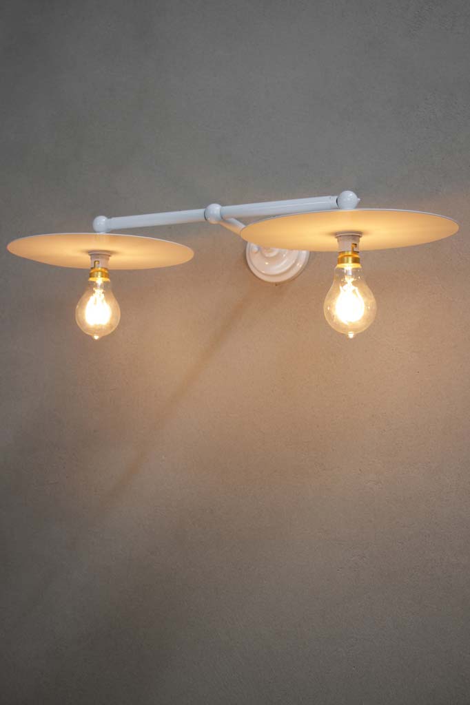 White wall light with large white discs