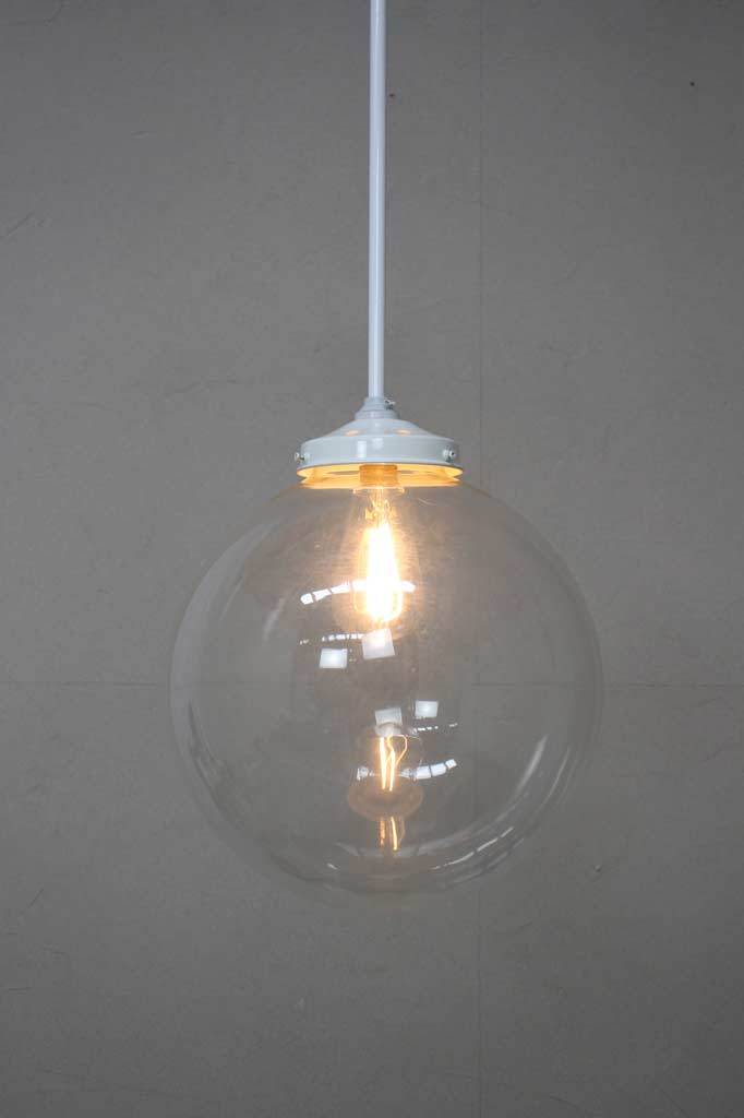 White pole pendant with large clear shade