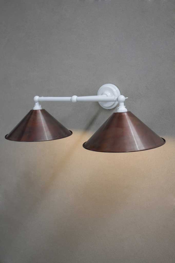 White double arm sconce with aged copper shades