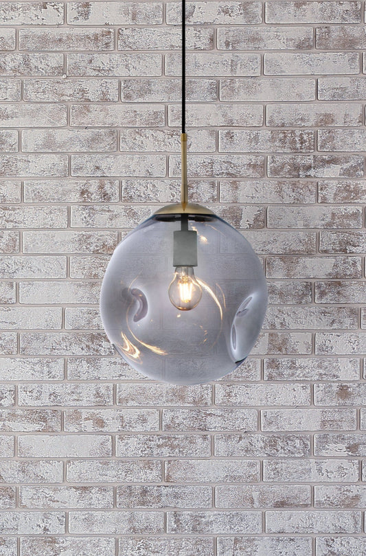 Large smoke glass pendant on a white washed brick wall