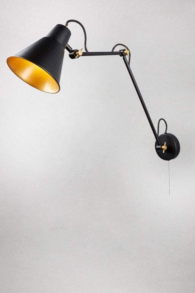 Black metal wall light with adjustable arm and gold fixtures