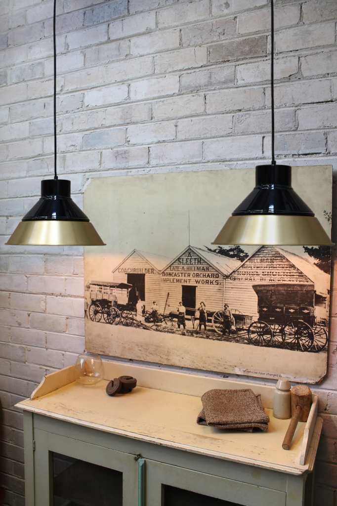 Bright brass shade with black cover 