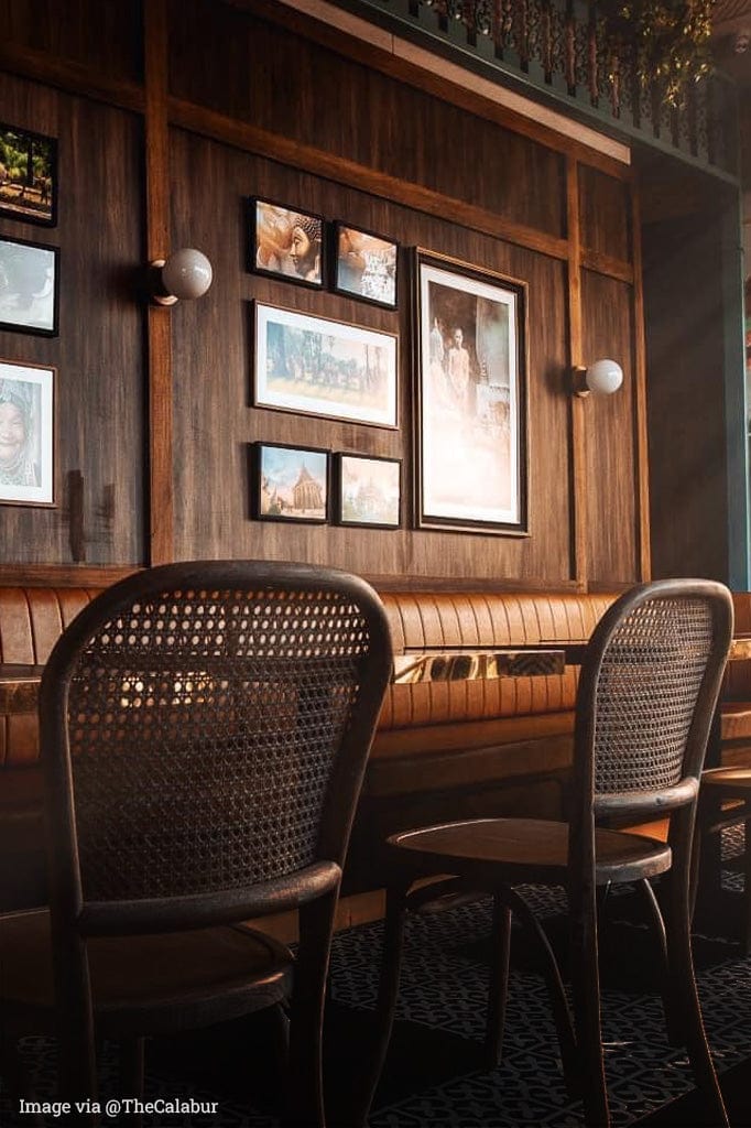 Bunker globe lights with a round milky glass ball in a restaurant wall.