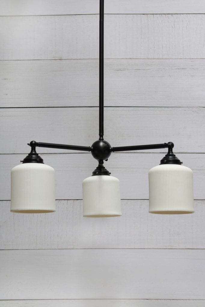 Multi light pendant with black finish and three ceramic shades