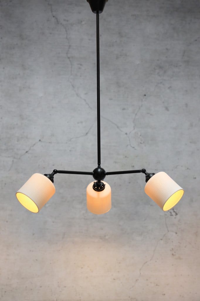 Multi light pendant with black finish and three angled ceramic shades