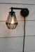 Black swivel wall light with switch