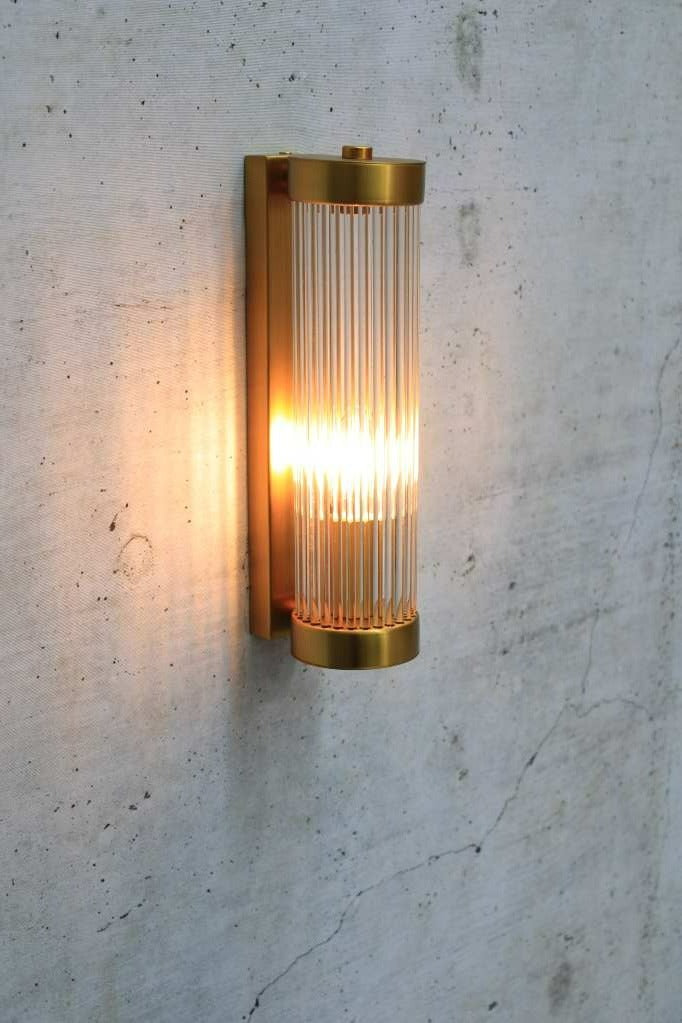 glass rod wall light in gold/brass finish