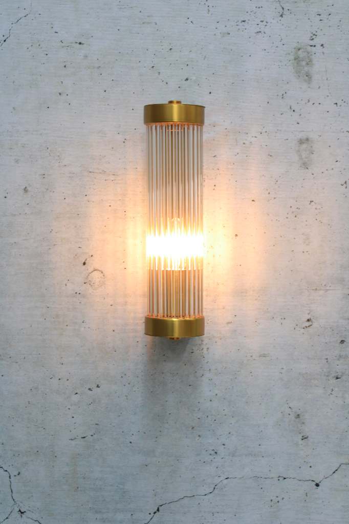 glass rod wall light in gold/brass finish