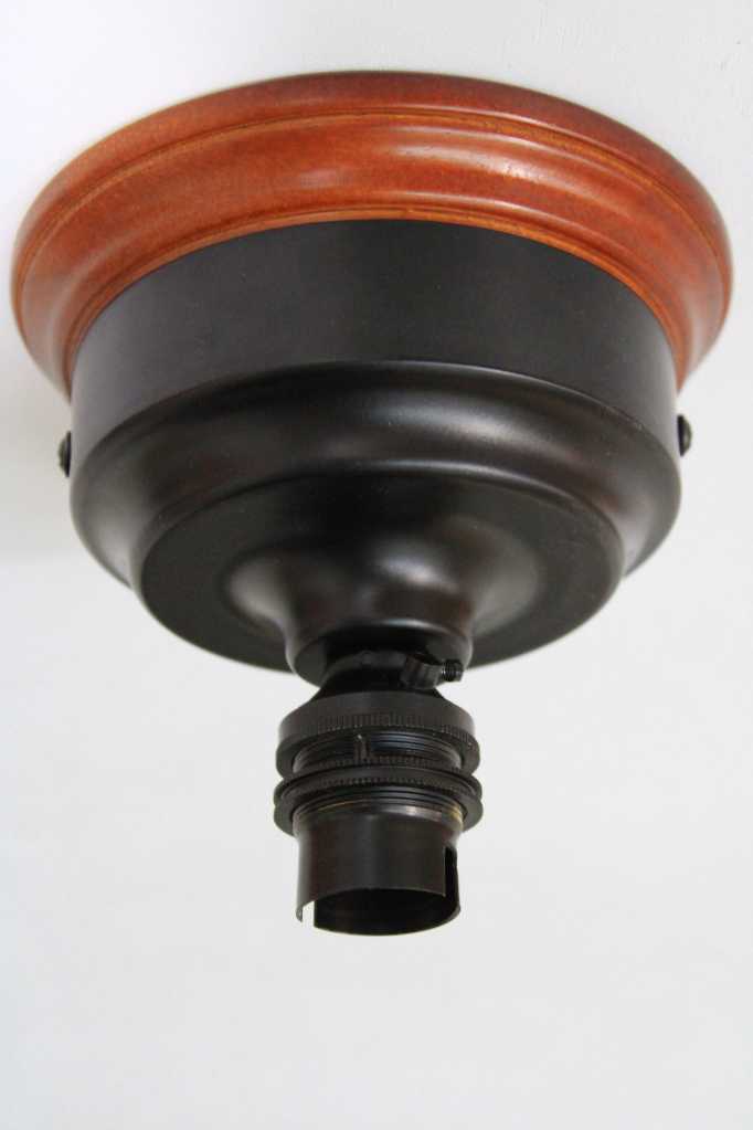 Ceiling batten light in black metal with wooden mounting block for more of a vintage appeal