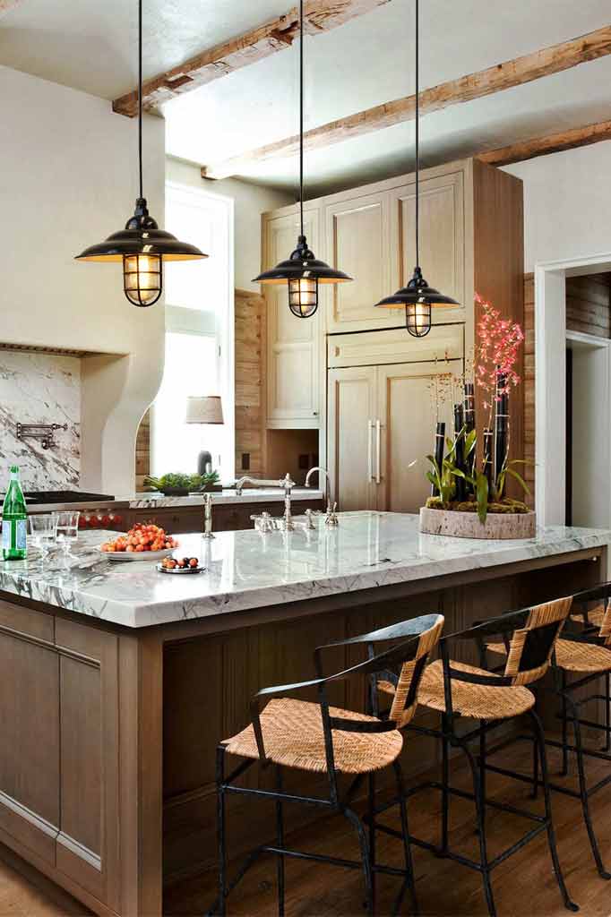 Industrial bunker pendant light over a kitchen island.