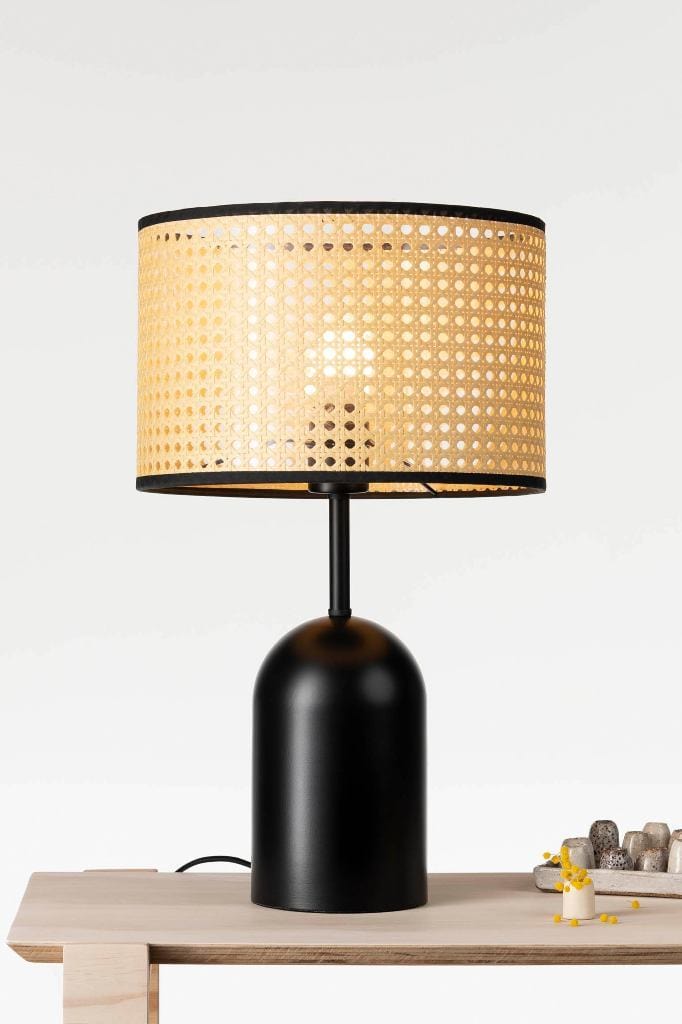 Table lamp with rattan shade and black base