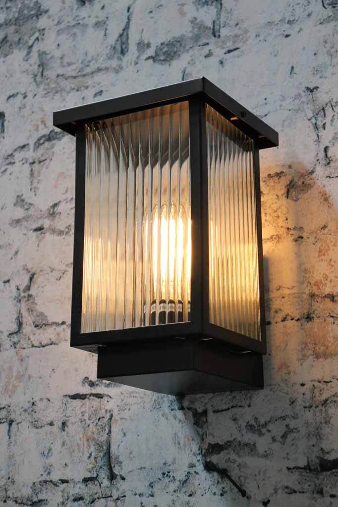 Needed glass panel outdoor wall light