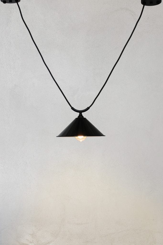 Small black steel cone shade on trapeze pendant