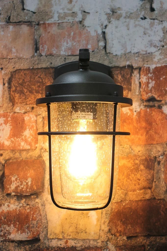 Small steel and glass wall light for outdoors