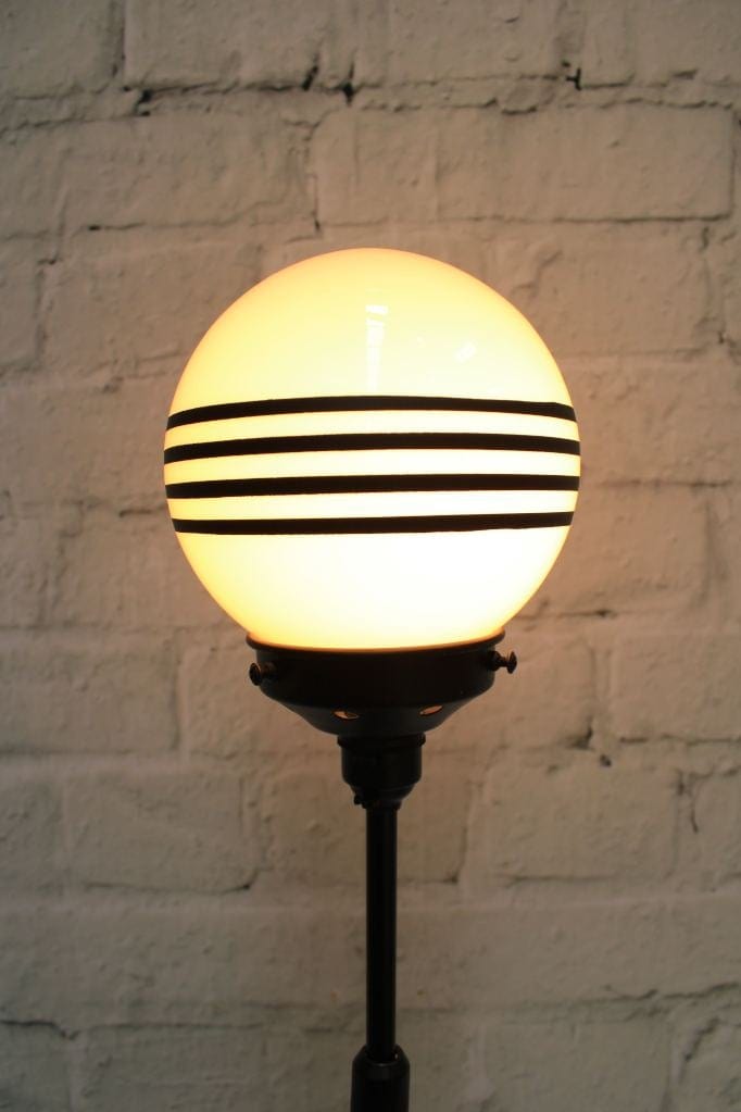 floor lamp with striped opal glass ball shade