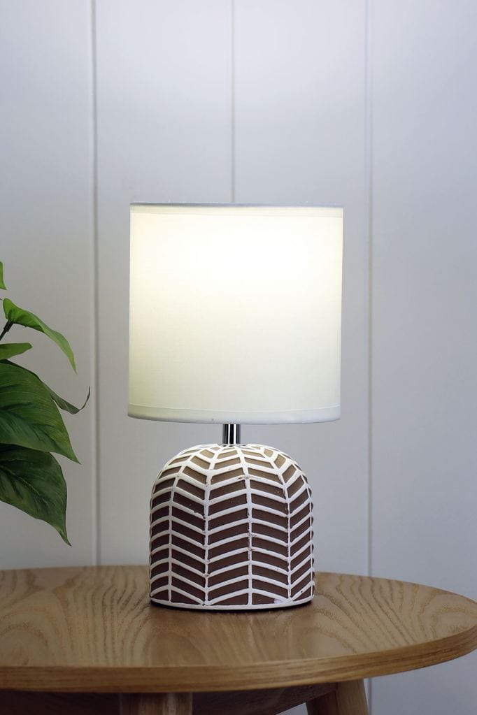 ceramic lamp with taupe and white finish and white fabric shade