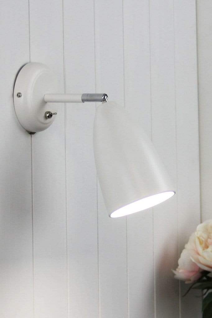 Tiltable wall light in white finish